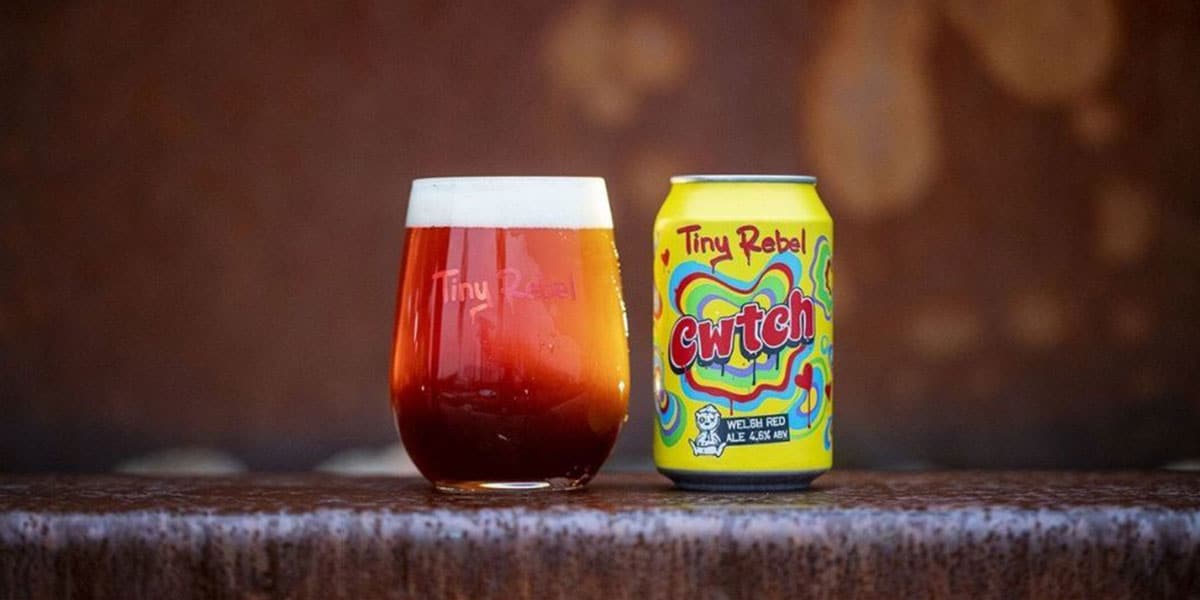 A can of Tiny Rebel Cwtch beside a glass poured